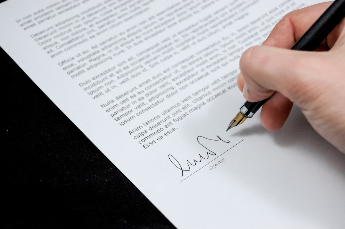 Person Signing Letter