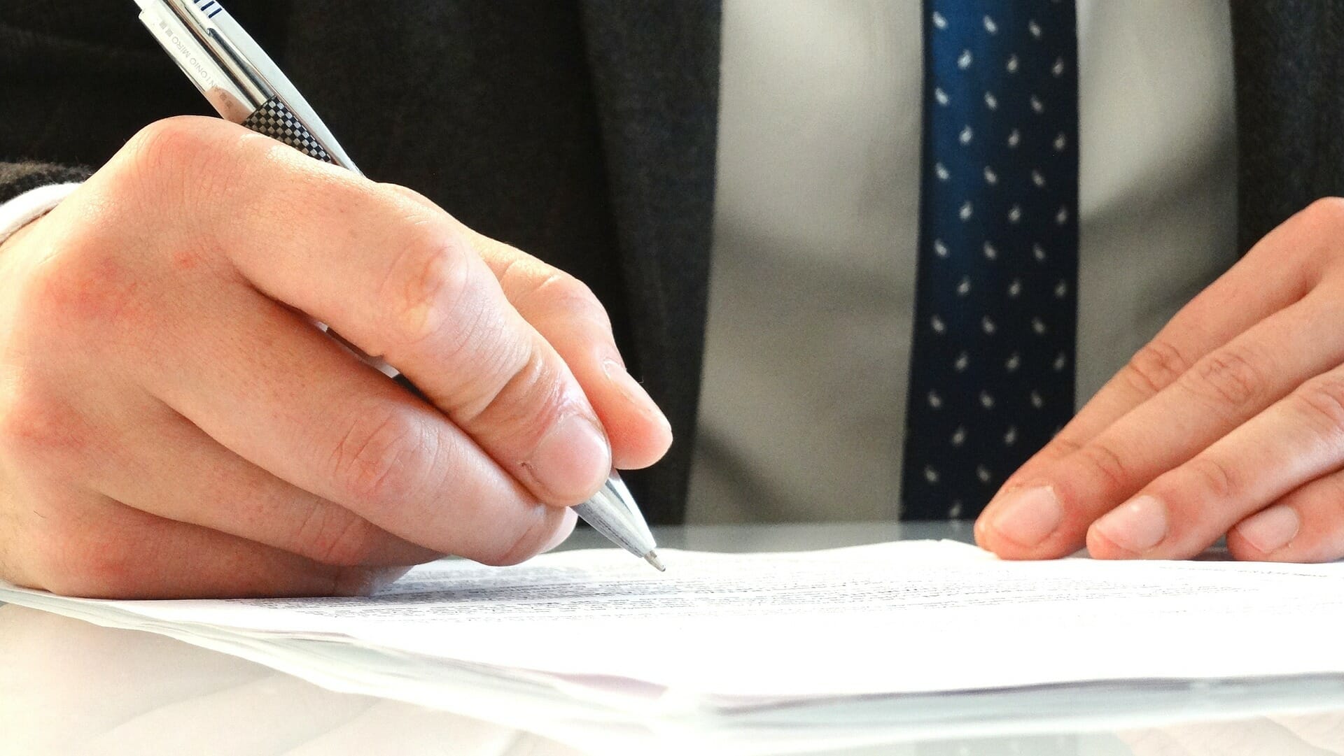 Man signing a document