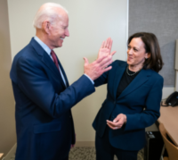 Biden and Harris high five each other