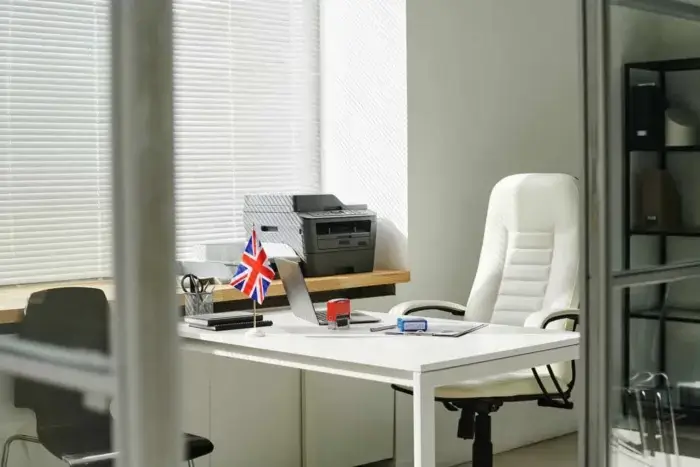 Small UK flag on employer's desk hiring international talent in the UK